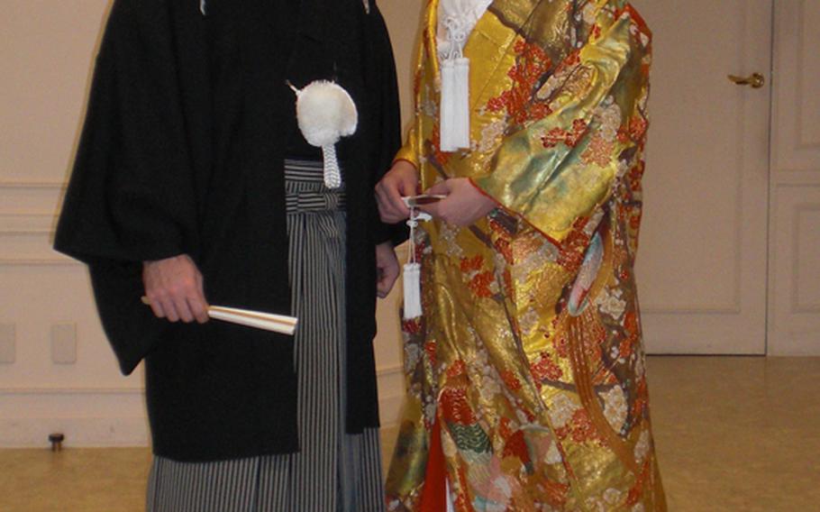 A Japanese wedding means at least three changes of clothes. Bride Tomoko and her groom Mike began the day in styles worn at most traditional ceremonies.