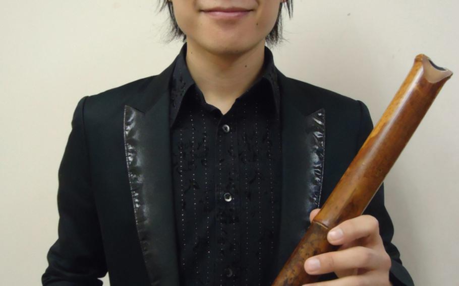 Fujiwara Dozan poses backstage after a recent concert in Sasebo, Japan. Japan’s prince of the shakuhachi, or bamboo flute, is known for his traditional Japanese songs as well as popular hits.