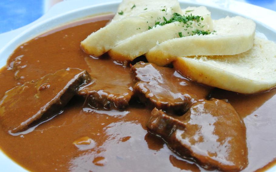 Bohemian knödel at Zum Alten Schuster, seen here with sauerbraten, is a personal favorite of the author. The thick slices are great for soaking up sauces.