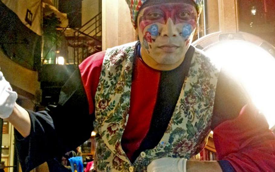 A multiitalented mime working the arcade in Kumamoto, Japan, can both break dance and stand perfectly still for eight hours.
