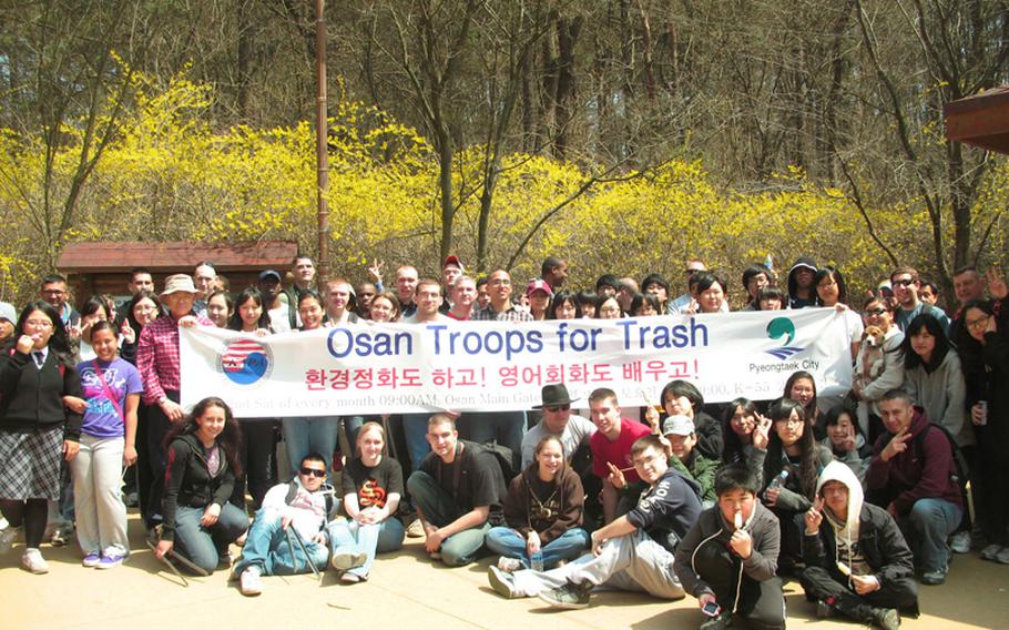 Hikers from Osan Air Base and the Korean-American Partnership association meet once a month to pick up trash on the Buraksan trail.