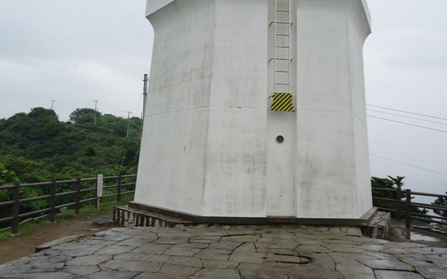 The Ioujima Lighthouse operated from 1870 until it was damaged by the atomic bomb blast that ended World War II on the mainland in 1945; it was restored is now a museum. The  original foundation of the lighthouse is in the foreground.