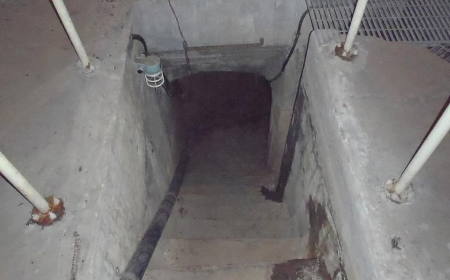 A staircase in a corridor of the WWII air defense command center near Sasebo, Japan, leads to an expansive tunnel system that is said to have reached all over the city.