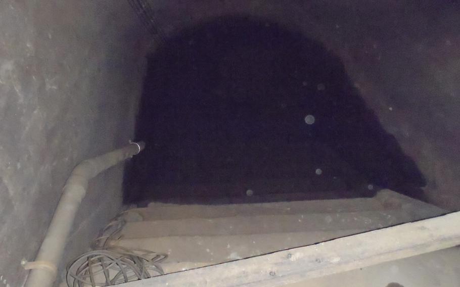 These stairs, leading to the underground tunnel system said to extend from the air defense command center all over the city of Sasebo, extend down into water that has risen since World War II and flooded the tunnels, thus making it impossible to know their extent.