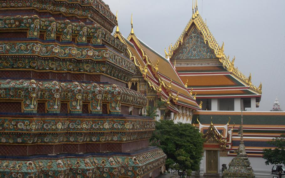 The vast Wat Po complex is full of soaring, golden spires and rich temples.