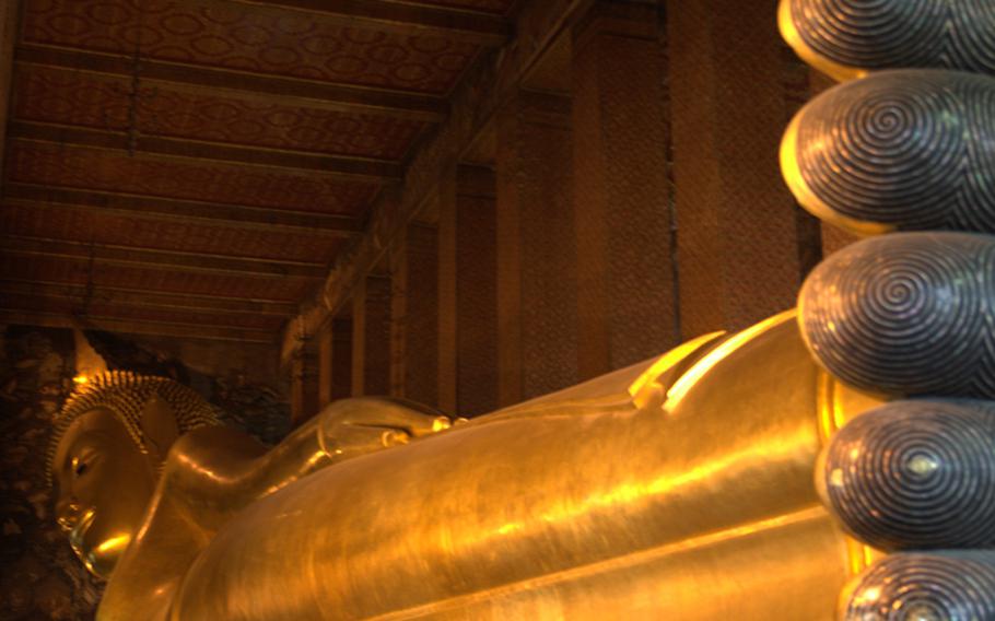 The reclining Buddha at Wat Po -- 50 feet high and 141 feet long -- is one of Bangkok's biggest attractions.