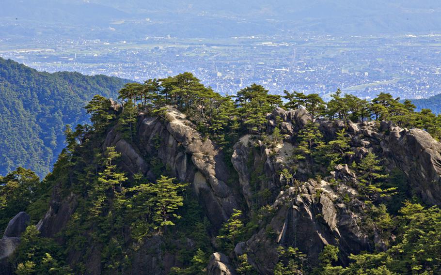 On clear days, the view from Mount Yasaburo-take includes Mount Fuji and Japan's Southern Alps. This is in Shosenkyo Valley in Yamanashi prefecture, Japan. 
