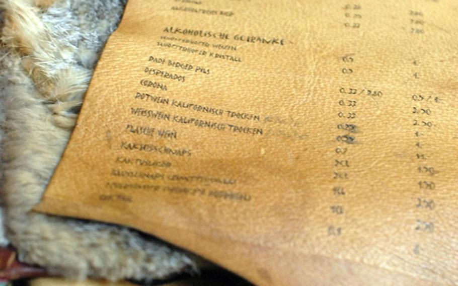 The drink menu rests on top of the book of entree listings at Manitou in Frankfurt, Germany.