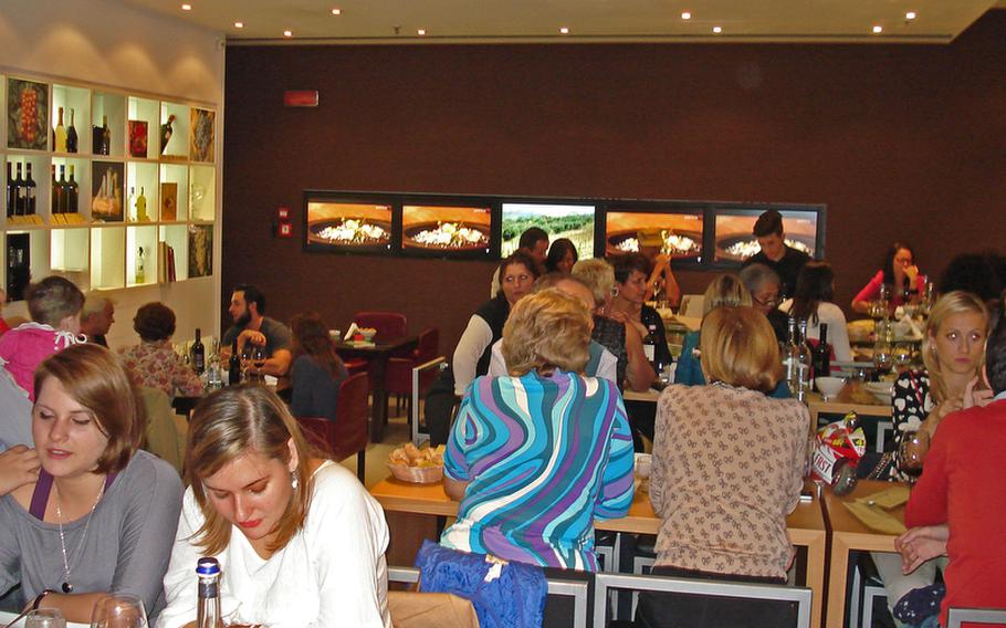 Even on a Monday evening, the Feudi di San Gregorio Wine Bar in the Vulcano Buono shopping mall in Nola, Italy, is full of guests sampling from the bar's generous selections of wine.