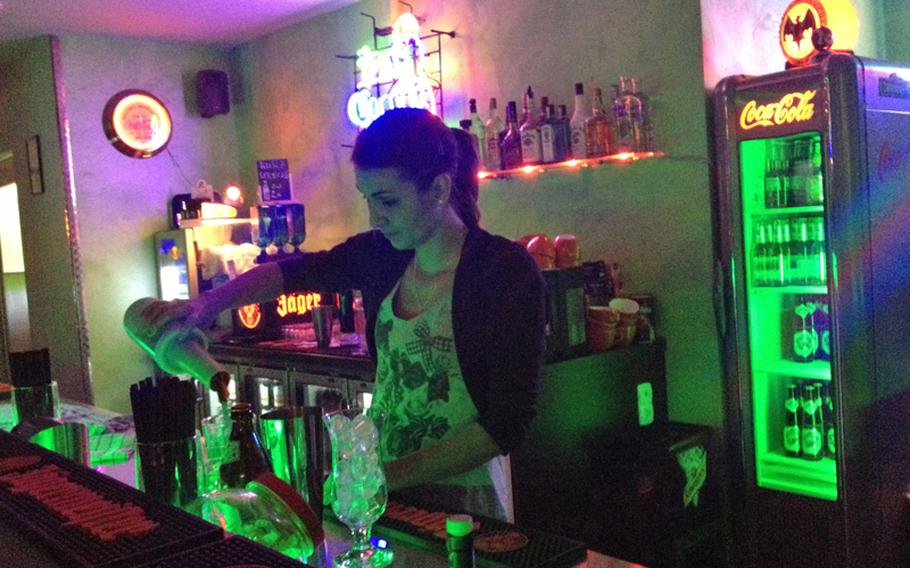 Mimi Liebrich, a bartender at Jake&#39;s Diner-Bar in Stuttgart, Germany, makes drinks in December 2012. Jake&#39;s offers an American-themed atmosphere reminiscent of the 1950s.