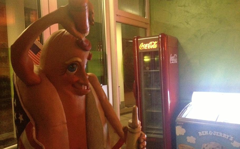 A giant hotdog pouring ketchup on his head greets customers at Jake&#39;s Diner-Bar in Stuttgart, Germany. With Coca-Cola decor and Norman Rockwell art, Jake&#39;s features all the fittings of a classic American diner.