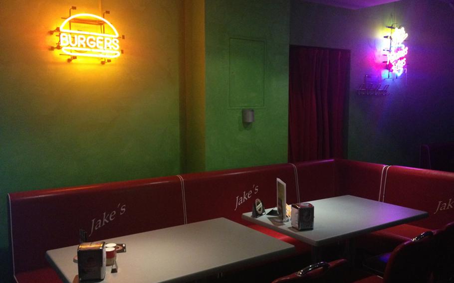 Customers at Jake's Diner-Bar will find themselves in a 1950's-style American diner with red leather booths, burger - and fry-shaped neons adorning the wall and classic Coca-Cola decor.