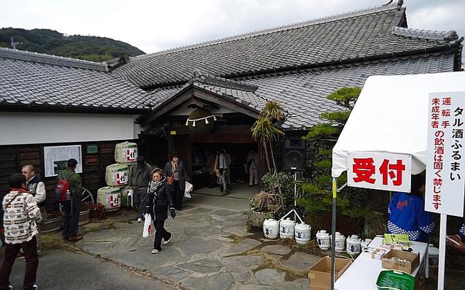 Sake enthusiasts explore Sasebo's Umegae sake brewery on Feb. 9 during an open house and tasting event. Breweries across Japan offer tours and tastings upon request.