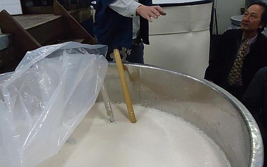 After the rice is steamed, the resulting rice and liquid is put in a barrel for one month to ferment before it is separated, as seen here at the Umegae sake brewery in Sasebo during a tour on Feb. 9. Breweries across Japan offer tours and tastings upon request.