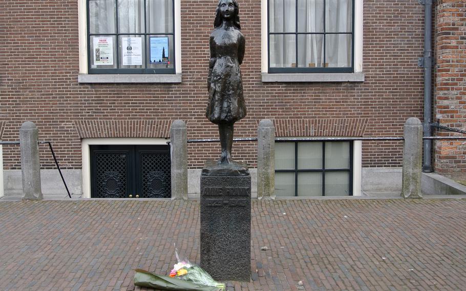 The Anne Frank statue in front of the Westerkerk in Amsterdam. The house where she once lived is now a museum, and just around the corner from the statue.