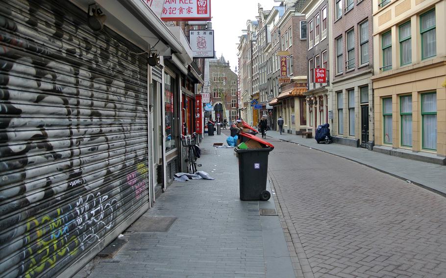 A street on the edge of Amsterdam's infamous red-light district is nearly deserted on a Saturday morning.