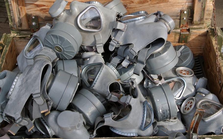 A collection of gas masks for sale at the Waterlooplein flea market in Amsterdam. Here you can buy military clothes and equipment, CDs and DVDs,  books and antiques.