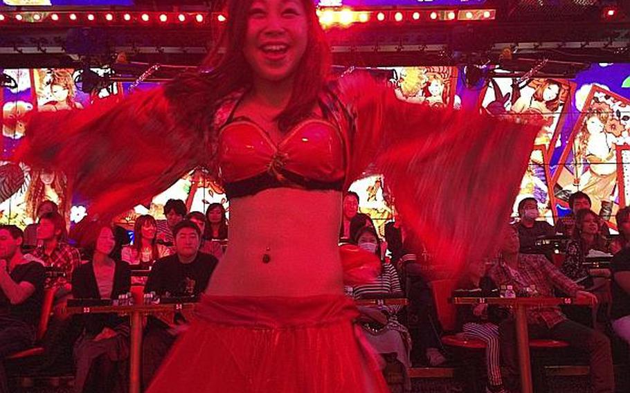 Dancers at the Robot Restaurant in Tokyo are exuberant and scantily clad, and some are even good with swords.
