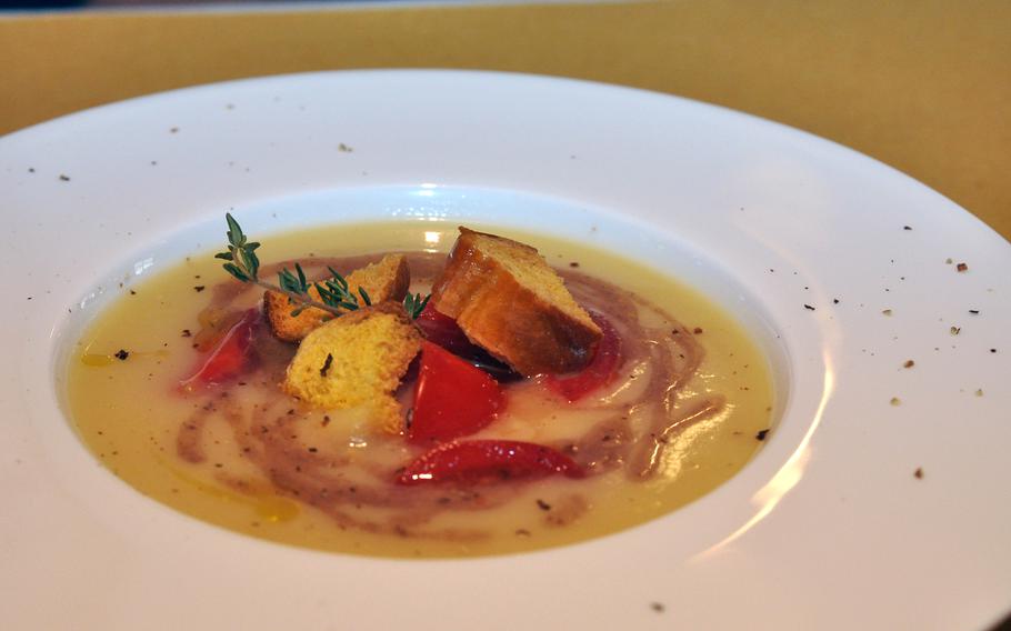 A cream of yellow zucchini soup featuring tomatoes, anchovies and croutons was a first-course option at Osteria Antico Burchiello in Pordenone, Italy. Don't get too attached to any specialty: The menu changes daily.