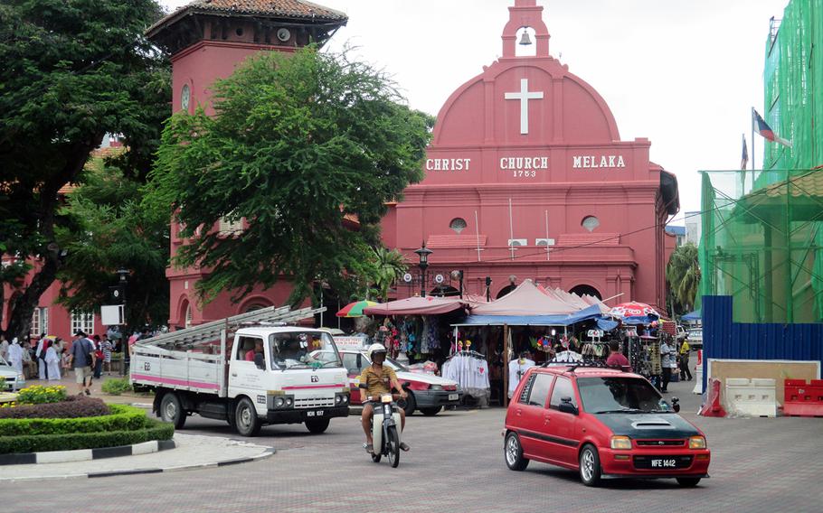 Melaka's Dutch Square Square, home to Christ Church and an adjacent clock tower, is a major stop for tourists for shopping as well as sightseeing.