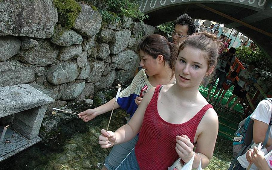 Summer Robson paricipates in a purification ritual at Shimogamo Jinja, one of Japan's oldest Shinto shrines.