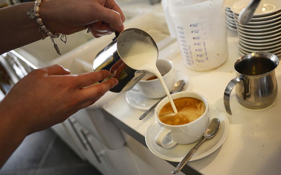 Steamed milk tops off a cappuccino at Kaffeerösterei Kaiserslautern.