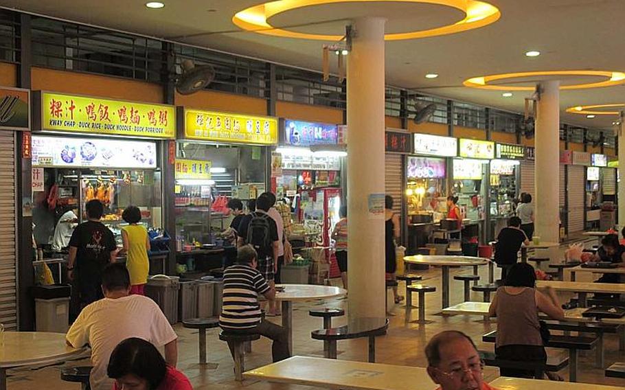 The Tiong Bahru hawker center is one of many markets in Singapore where you can buy an inexpensive, cooked-to-order meal from various vending stalls.