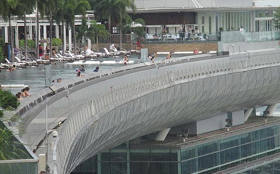 The infinity pool at the Marina Bay Sands resort in Singapore offers a panoramic view of the city, but access is limited to hotel guests.