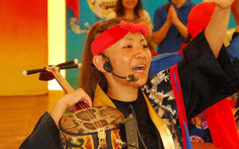 The island's traditional eisa dancing is part of the Okinawa World experience.