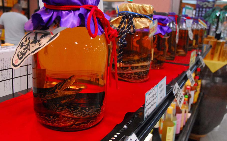 Habu sake, a local delicacy infused with the island's poisonous snake, is distilled at the park.