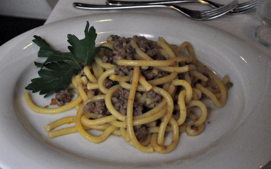 Bigoli pasta with meat sauce is one of a handful of first course offerings on the standard menu of Hostaria Via Caprera in Vittorio Veneto, Italy. The restaurant also has seasonal offerings that change every five days.