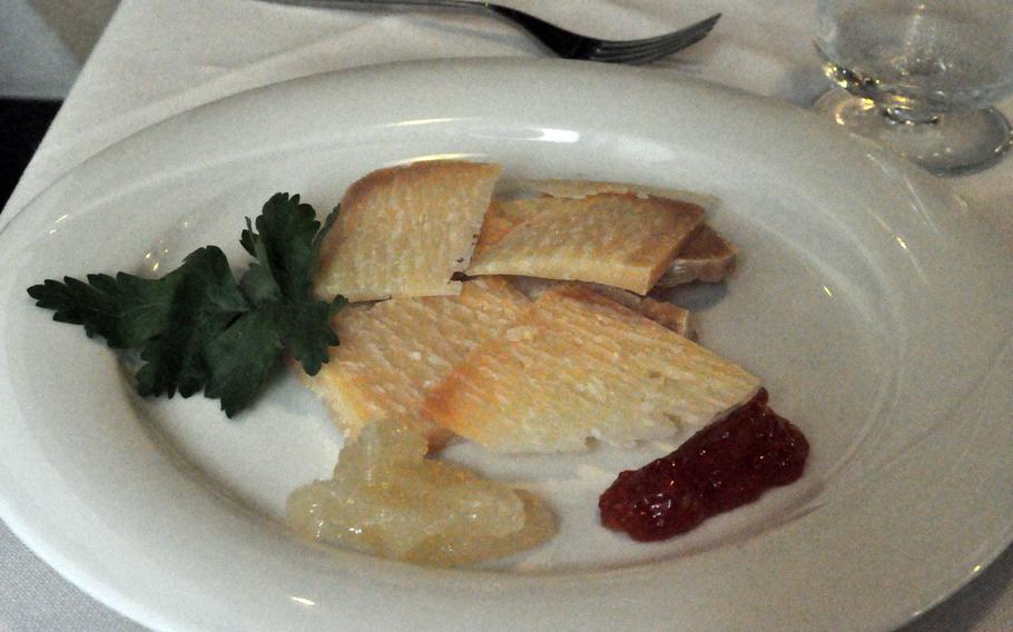 For those with a lighter appetite, it's possible to select a local cheese --- such as Montasio stravecio --- for a second course at Hostaria Via Caprera in Vittorio, Veneto, Italy. Sweet tomato and pear sauces add even more flavor.