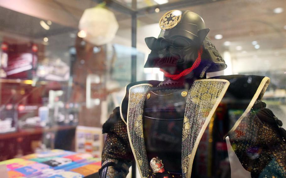 The Hakuhinkan Toy Park in Ginza has a section dedicated to toys for grown-ups like this samurai-Darth Vader statue.