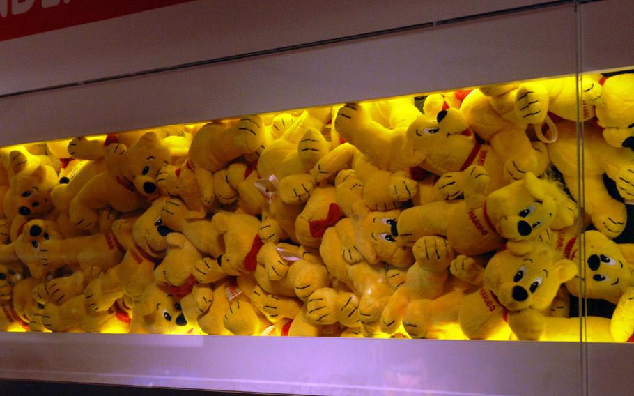 A collection of plush teddy bears is displayed at the Haribo store in Bonn, Germany, on Friday, Dec. 20, 2013.