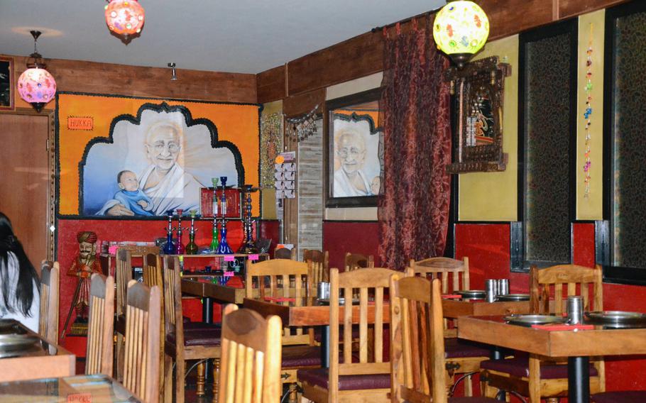 Indian-themed decor features prominently in the main dining area at New Punjab, an Indian restaurant in Fontanafredda, Italy.