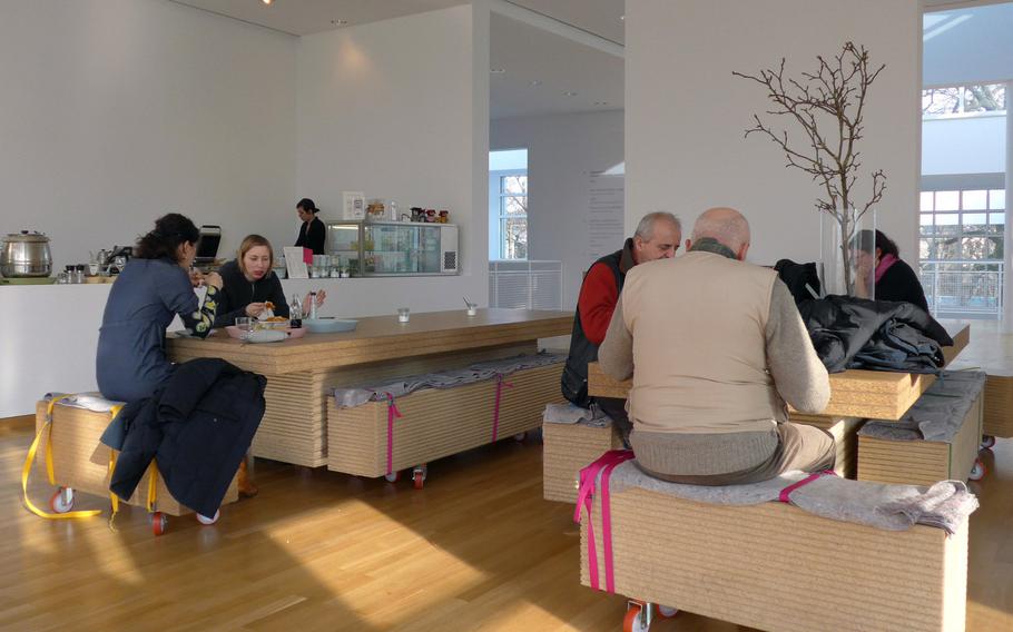 Visitors to Frankfurt's Museum Angewandte Kunst, or Applied Arts Museum, enjoy a bite to eat in the museum's third-floor cafe.