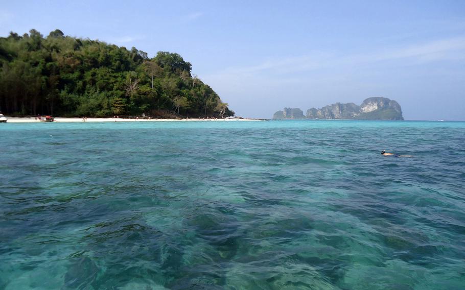 A man snorkels off the remote Bamboo Island.