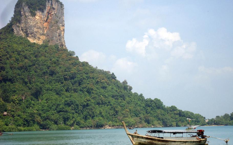 A Thai water taxi is parked and waiting for passengers off east Railay.