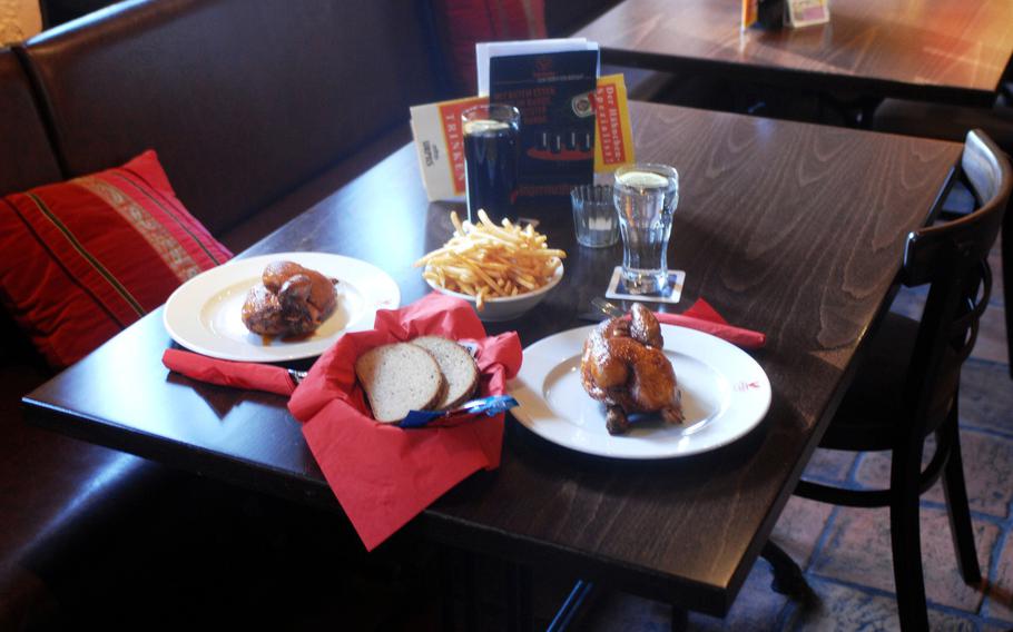 Two half chickens, bread, French fries and soft drinks are served at á Pollo in Kaiserslautern, Germany.