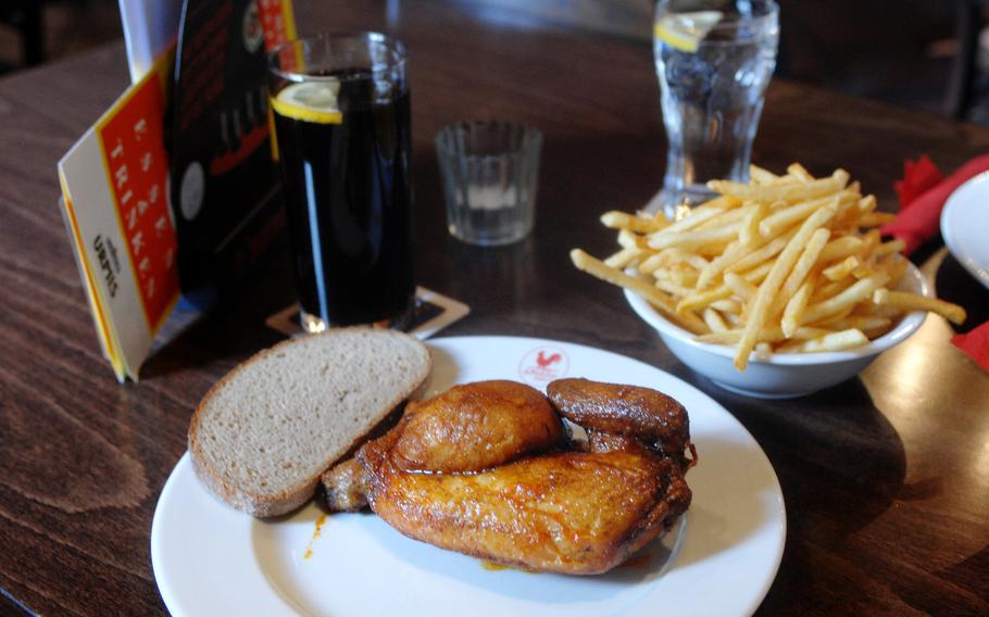  A half chicken with fries and bread at á Pollo, a chicken-only restaurant in Kaiserslautern, Germany.