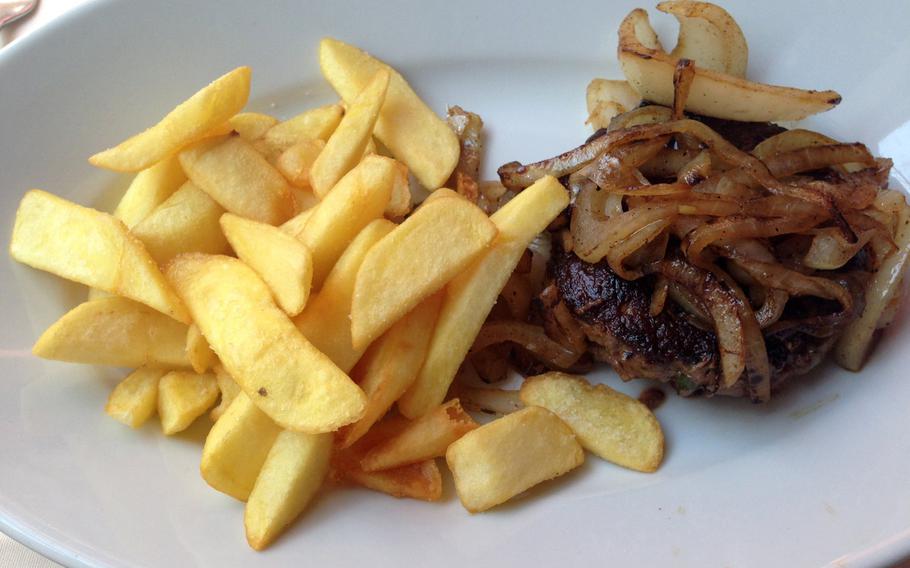 This hearty chunk of beefsteak topped with sweet grilled onions and served with lightly salted steak fries was among the main course options for the lunch special at Beef 'n Reef in Wiesbaden, Germany.