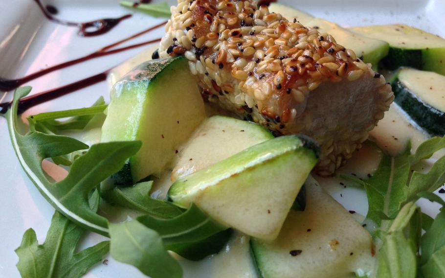 Beef 'n Reef's 10.90-euro lunch specials feature appetizers like this petite tuna portion rolled in sesame seeds, topped with zucchini and arugula leaves and sprinkled in a light balsamic dressing.