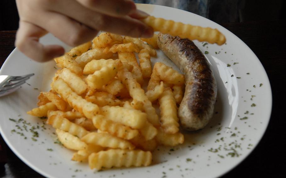 One of the most popular items at Weberstübchen, near Ramstein Air Base, is Thomas Walter's homemade German bratwurst, pictured here in the children's portion.