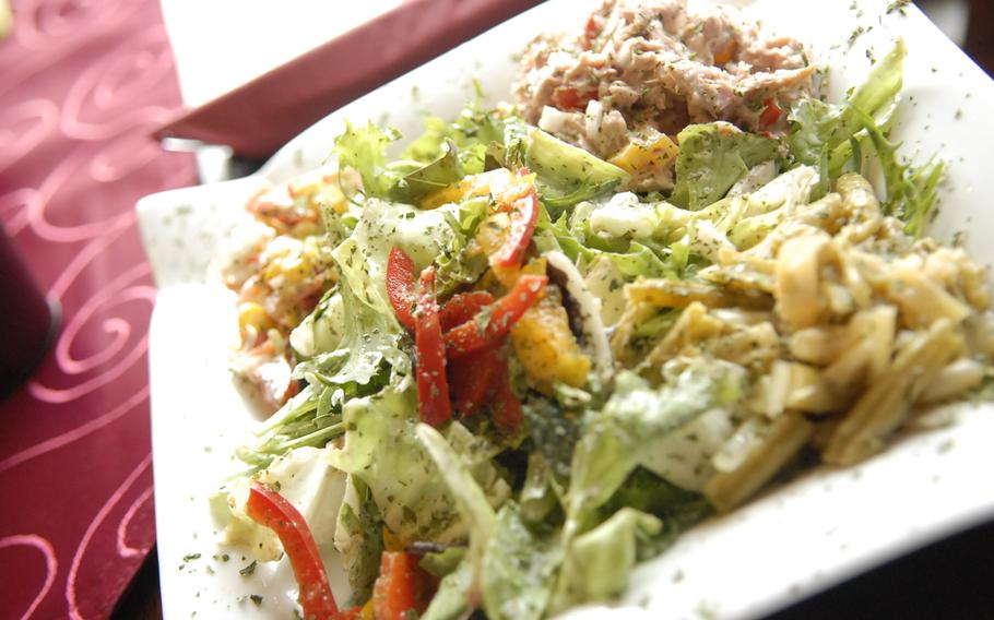 Though meat dominates the menu at Weberstübchen in Ramstein-Miesenbach, Germany, some lighter fare, such as this salad with tuna, onions and pasta, is also available. The eatery has a wide variety of pork, beef and turkey dishes.