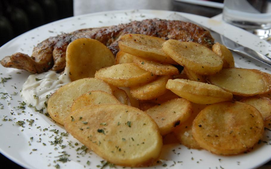 Turkey steak marinated in a garlic sauce came with a side of "potato chips," fried potatoes that look like chips, at  Weberstübchen, a German restaurant on the outskirts of Ramstein-Miesenbach.