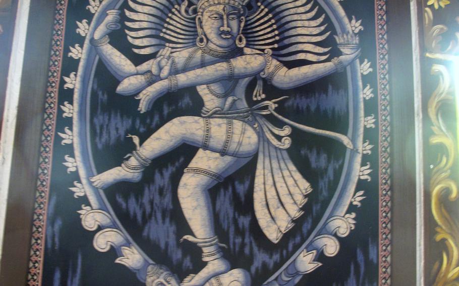 Hindu-inspired artwork, such as this painting of the god Shiva, decorates the walls throughout the Ganesha restaurant in Stuttgart, Germany.