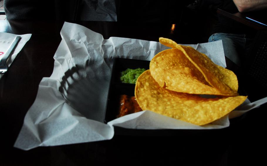 Chips are served with tomatillo salso verde and roasted onion chipotle salsa with each meal at Vatos Urban Tacos.