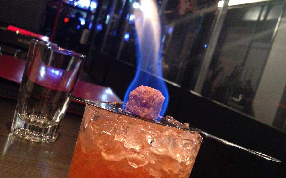 The most popular cocktail at the EA Shooting Bar is the SPAS-12, a mixture of fruit juices, rum and brown sugar that is served aflame.