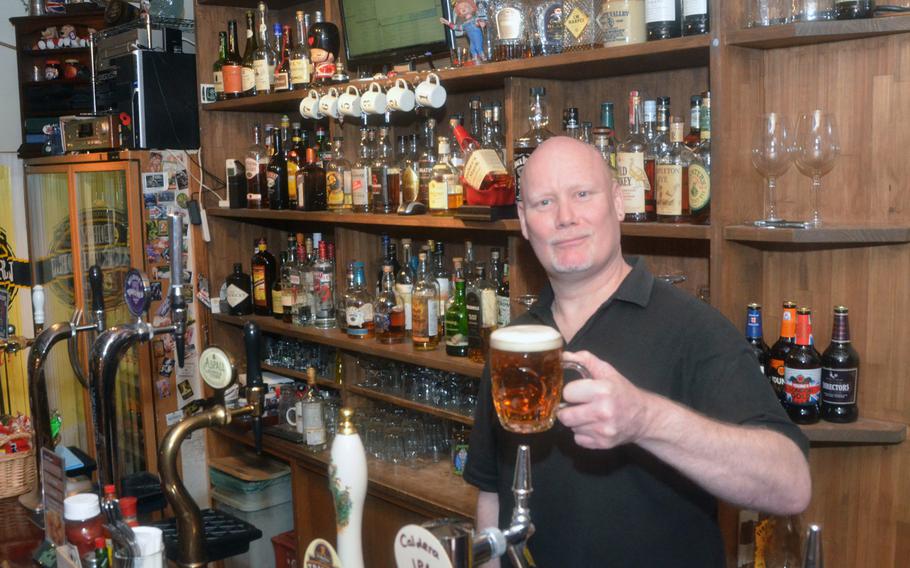 Clive Poole serves up a pint of ale at Full Monty in Yokohama. The British pub features a rotating variety of craft beers and ciders.