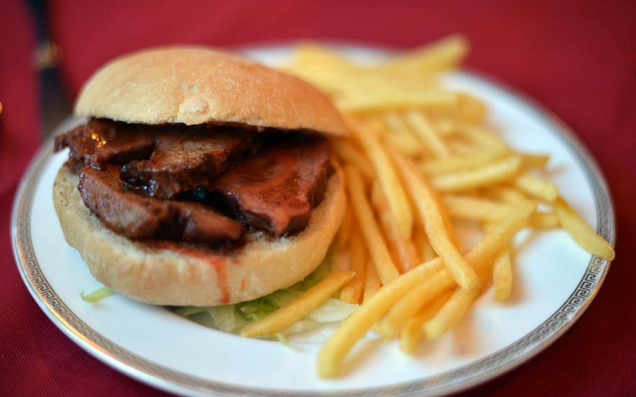 The beef brisket sandwich at Lone Star BBQ Smokehouse in Monte di Procida, Italy, near Naples, is served on a ciabatta roll with shoestring fries. The so-called hot sauce on this sandwich didn’t live up to its billing.